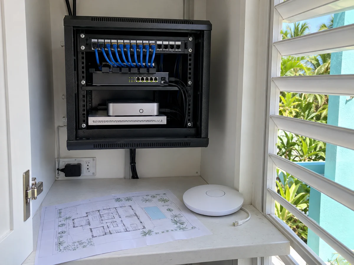 Illustrative compact home network cabinet with patch panel, switch, router and Wi-Fi access point